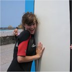French language student learning to surf