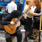 Guitar playing for street tango
